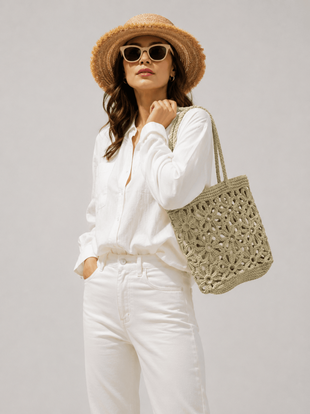Woven straw bag with floral pattern